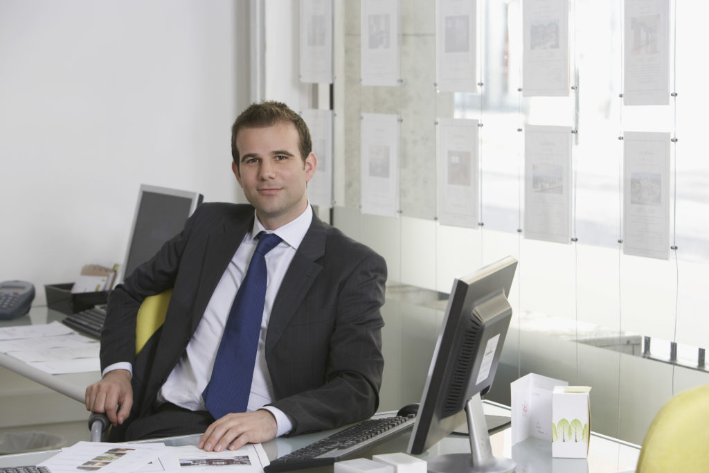 Real Estate Agent at Desk